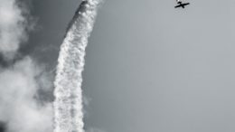 airplane contrail grayscale photo